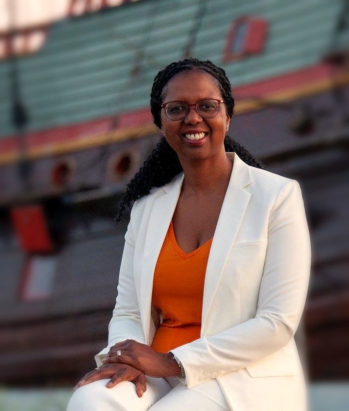 Beverly Whitfield, founder of Tidemark Hospitality, in a white blazer, smiling